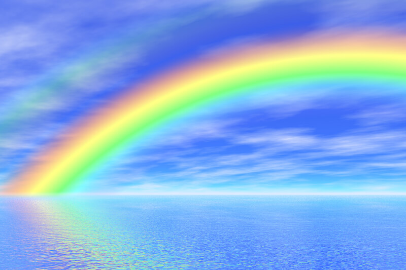 Rainbow over a large body of water